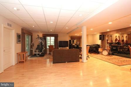 7104 River Road Bethesda, MD 20817 - Photo 8 of 29 Recreation Room with Spring Maple flooring