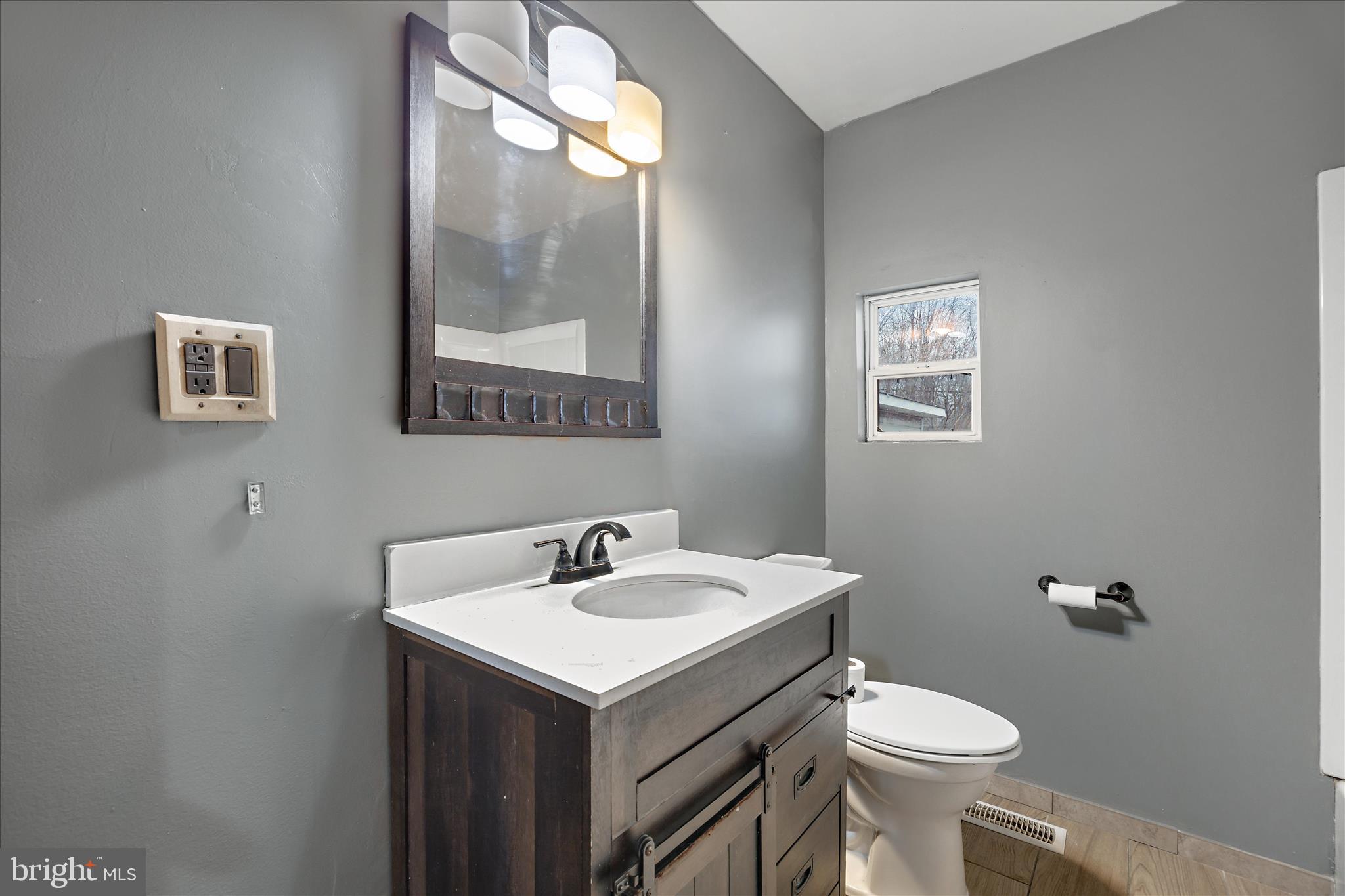 518 Kintop Road Glen Burnie, MD 21061 - Photo 14 of 33 a bathroom with a sink and mirror