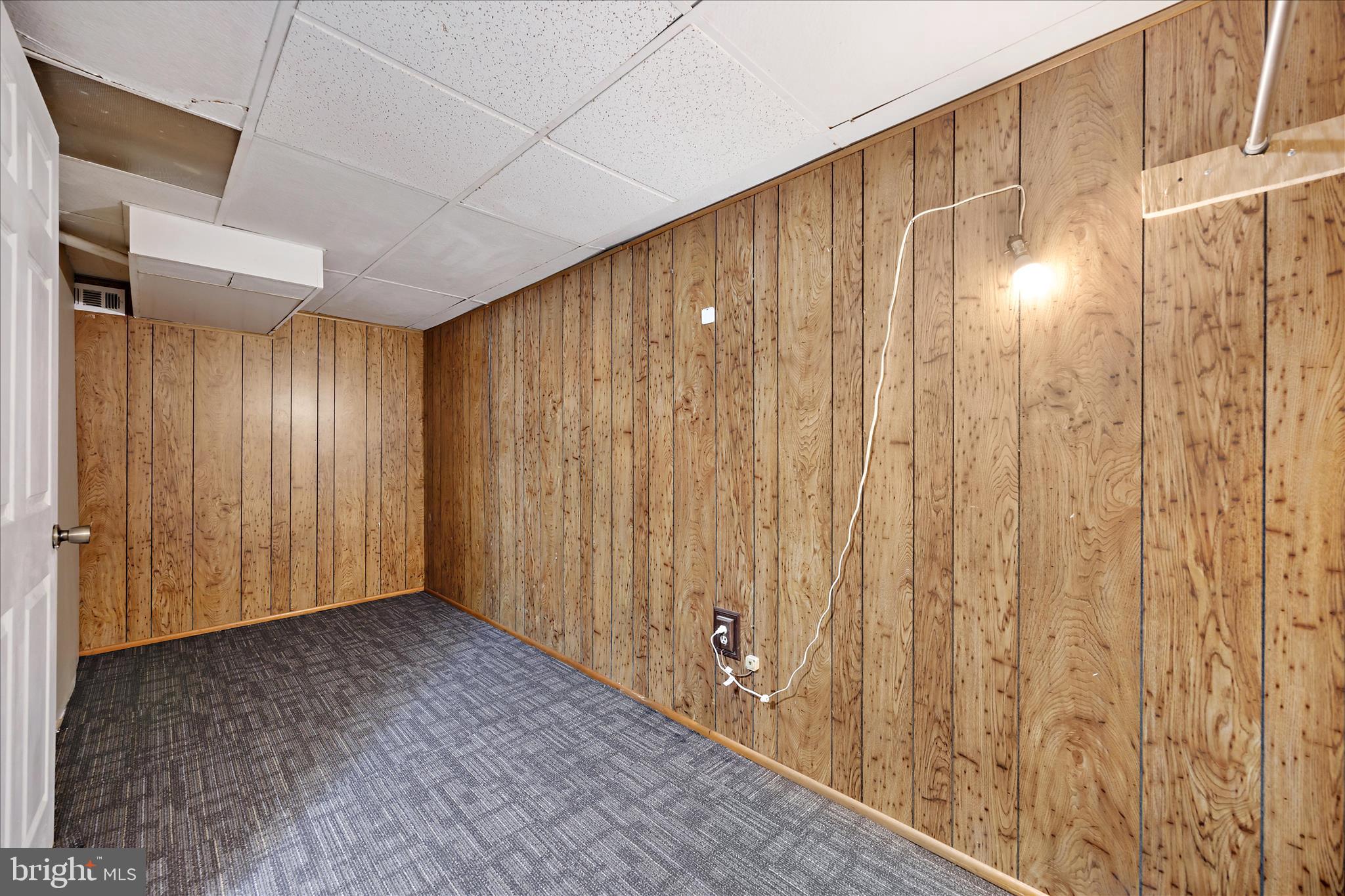 518 Kintop Road Glen Burnie, MD 21061 - Photo 29 of 33 a view of an empty room with wooden walls