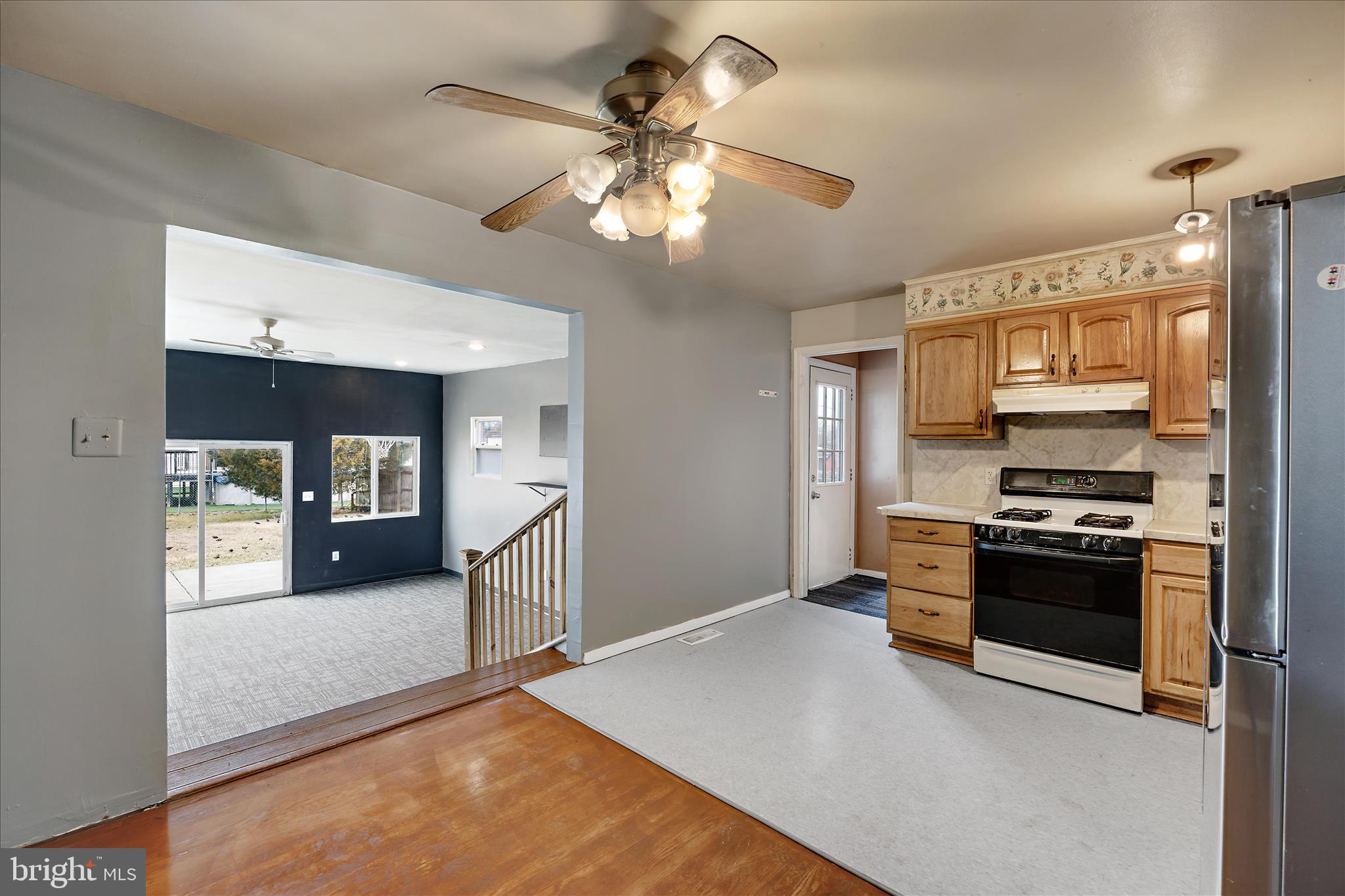 518 Kintop Road Glen Burnie, MD 21061 - Photo 7 of 33 a kitchen with stainless steel appliances granite countertop a stove and a refrigerator