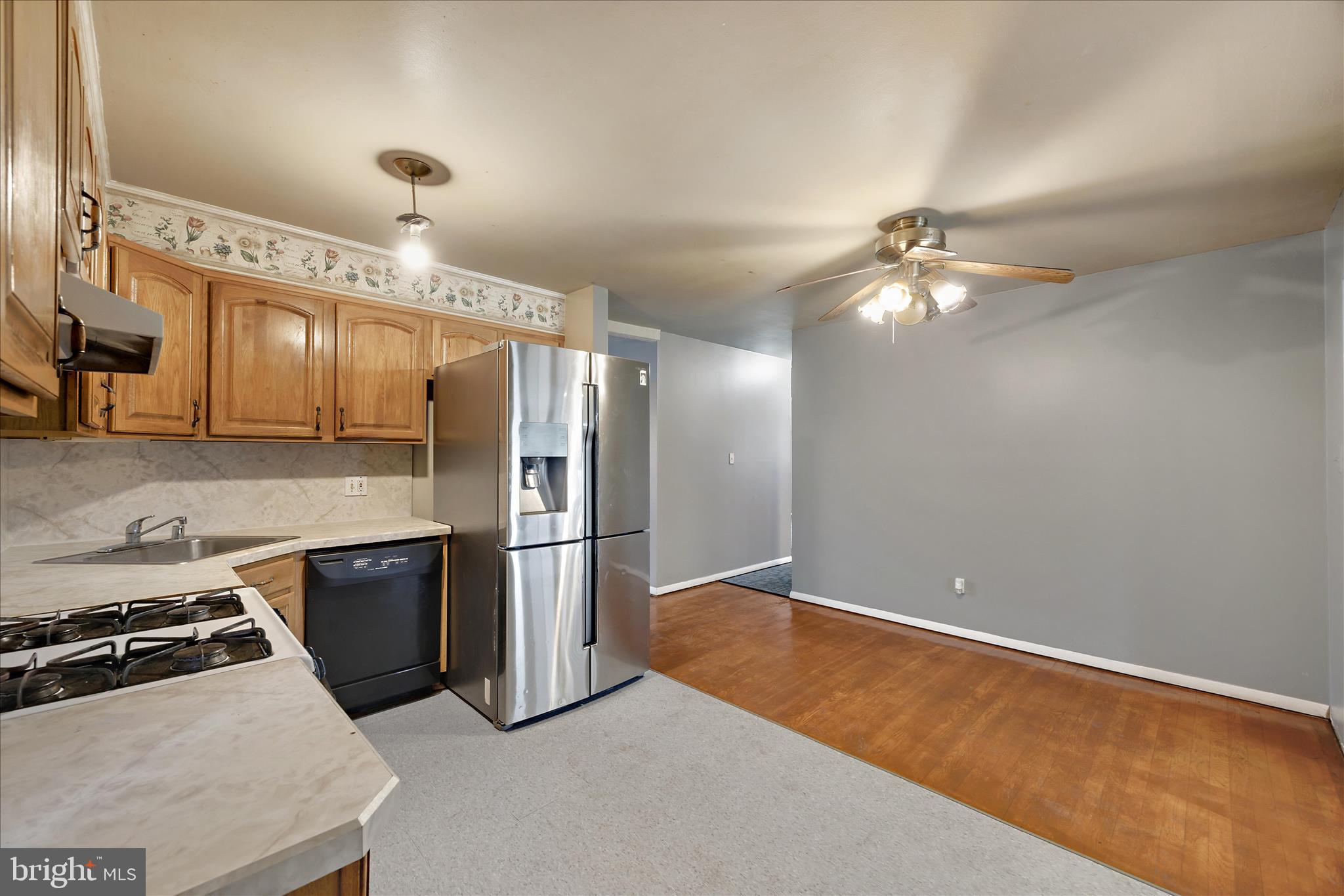518 Kintop Road Glen Burnie, MD 21061 - Photo 8 of 33 a kitchen with kitchen island a counter top space appliances and cabinets