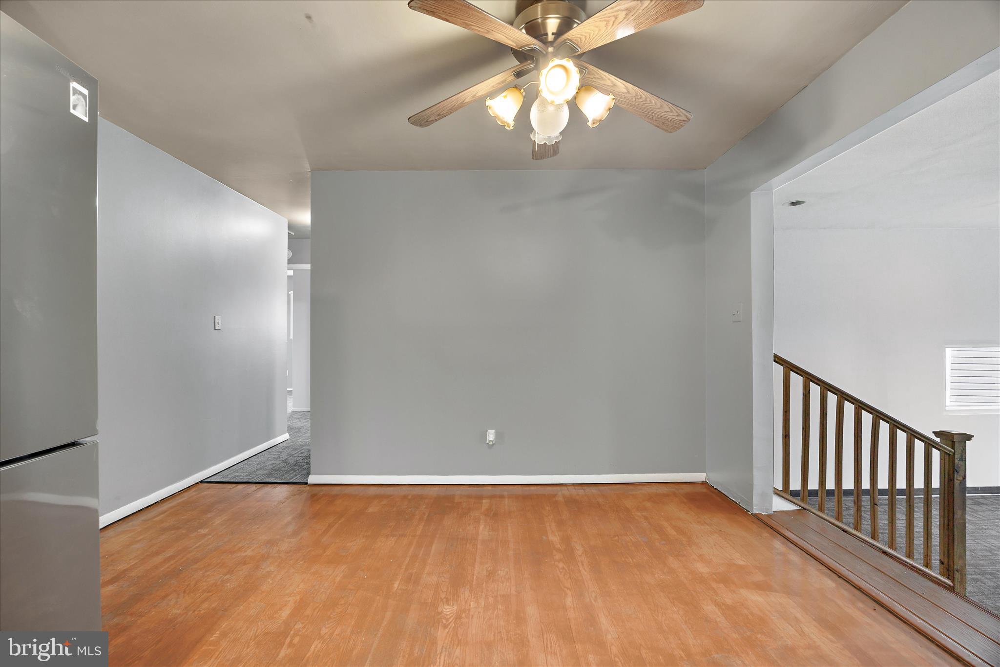 518 Kintop Road Glen Burnie, MD 21061 - Photo 9 of 33 an empty room with wooden floor and fan