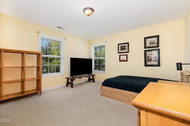 a bedroom with furniture and window