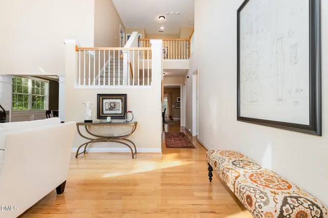 a living room with furniture a rug and a chandelier