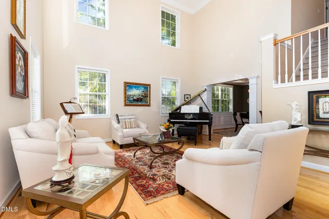 a living room with furniture a fireplace and a table