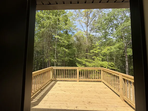 a view of balcony with wooden floor