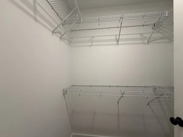 a view of a room with racks on the wall