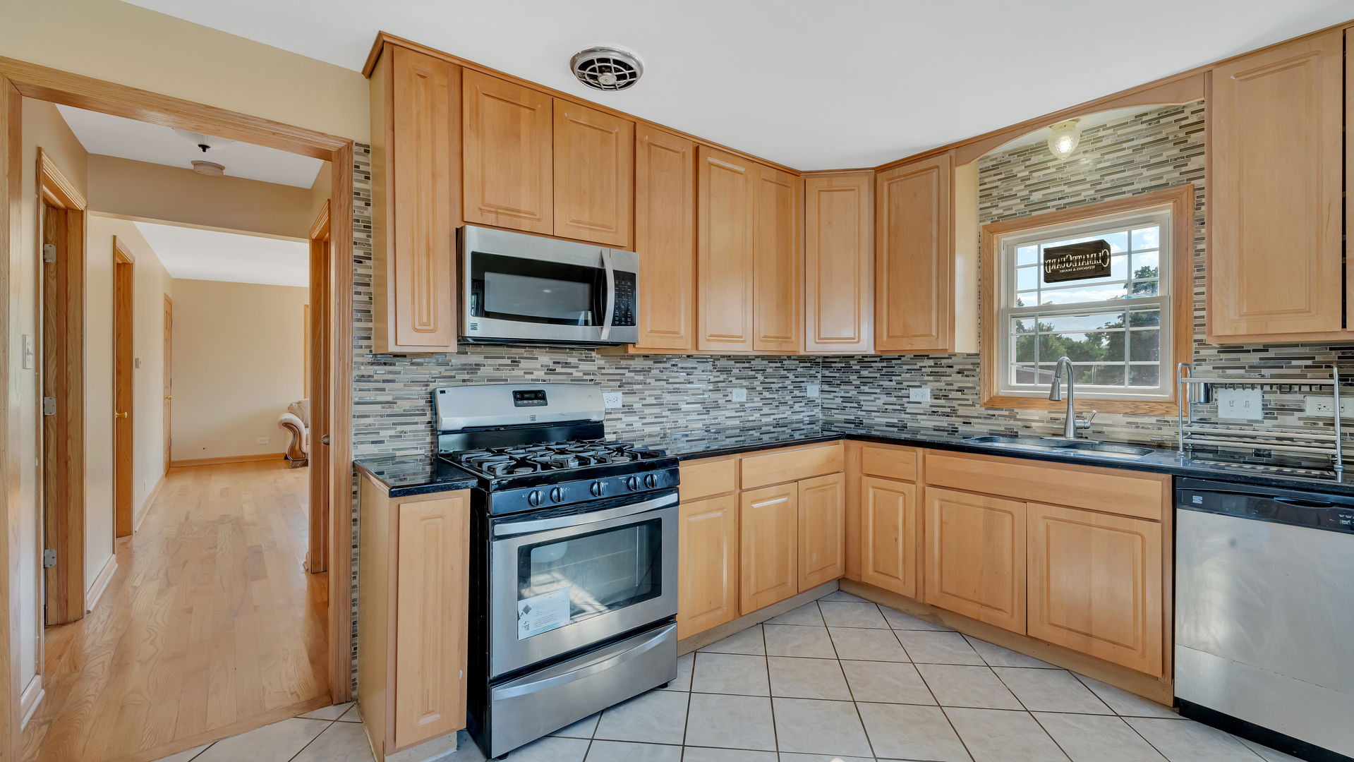 10601 Mason Avenue Chicago Ridge, IL 60415 - Photo 5 of 18 a kitchen with granite countertop cabinets stainless steel appliances and a sink