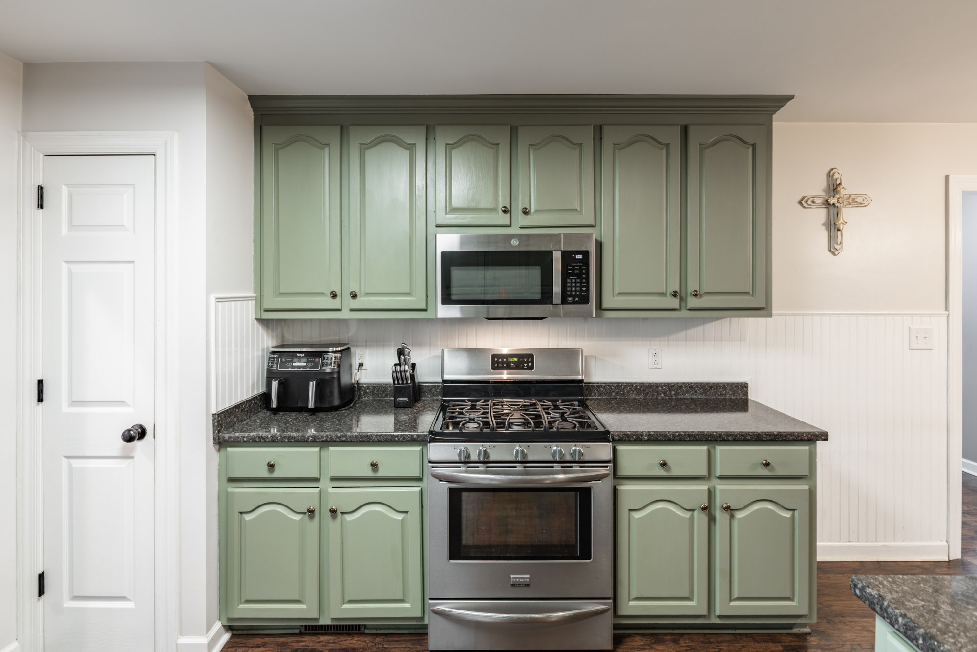 61 Eastridge Road Fayetteville, TN 37334 - Photo 12 of 42 a kitchen with granite countertop white cabinets and stainless steel appliances