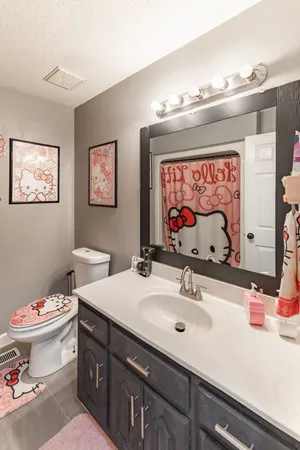 a kitchen with a stove sink and cabinets