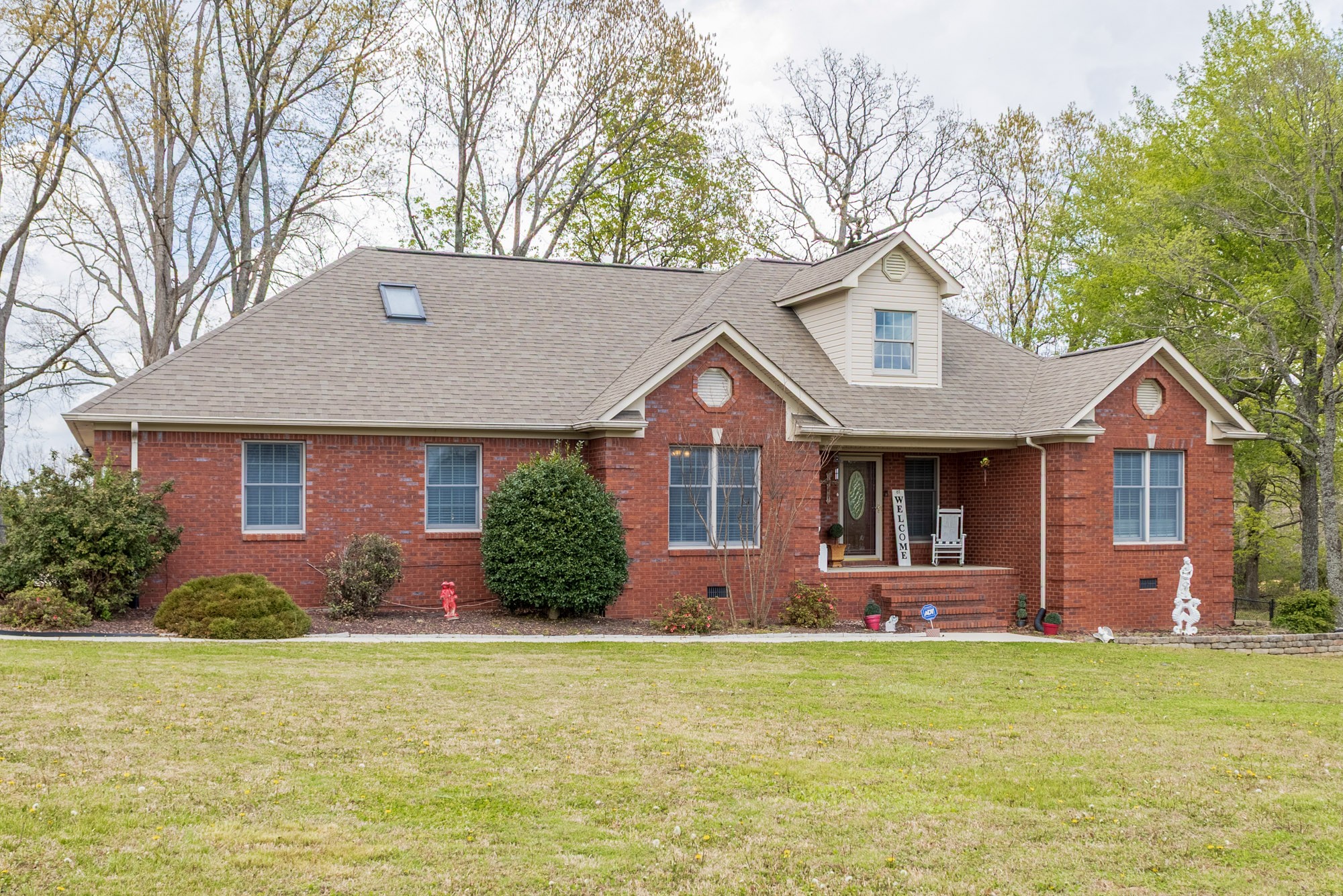 61 Eastridge Road Fayetteville, TN 37334 - Photo 3 of 42 a front view of a house with garden