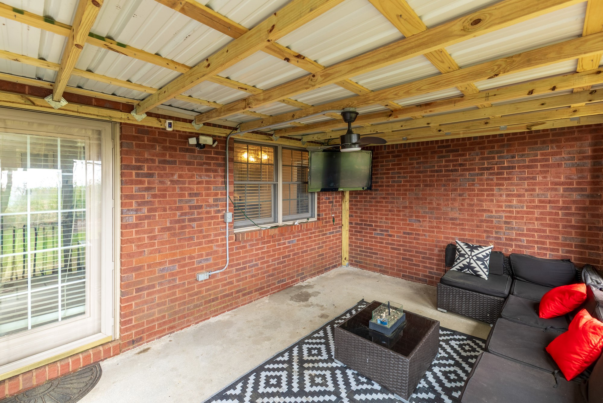 61 Eastridge Road Fayetteville, TN 37334 - Photo 35 of 42 a view of a patio with a table and chairs and potted plants