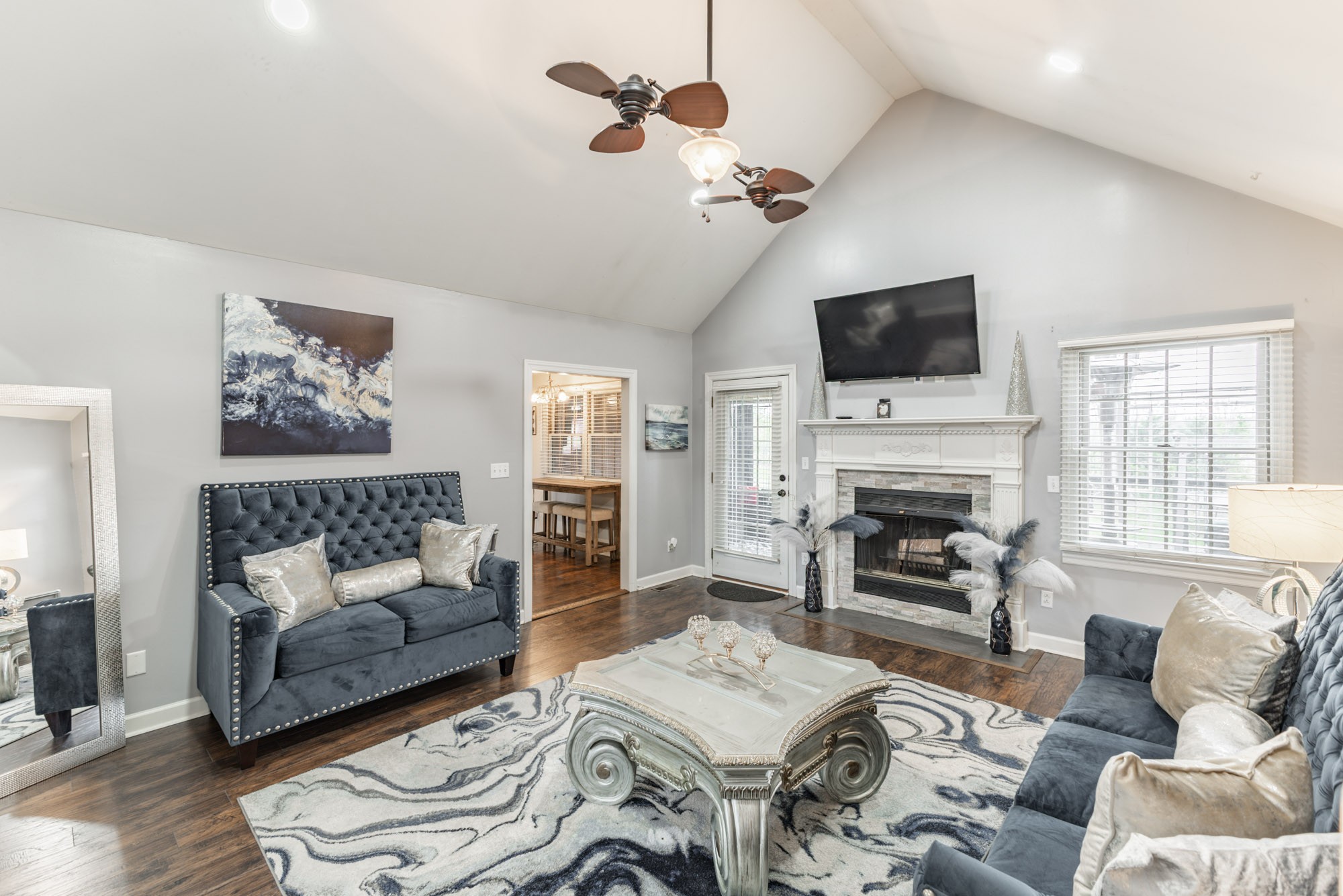 61 Eastridge Road Fayetteville, TN 37334 - Photo 8 of 42 a living room with furniture a fireplace and a flat screen tv