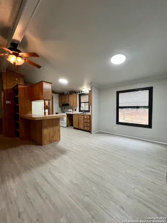 a view of a kitchen with a sink and a microwave