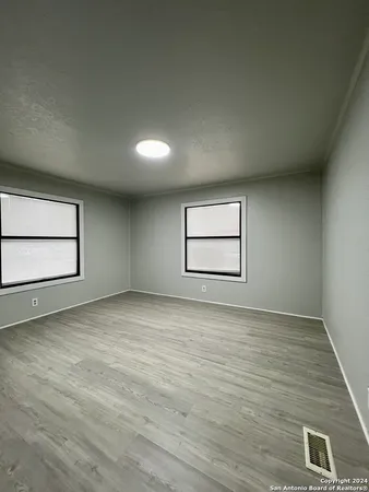 an empty room with a empty space and window
