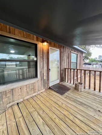 a view of a balcony with wooden floor