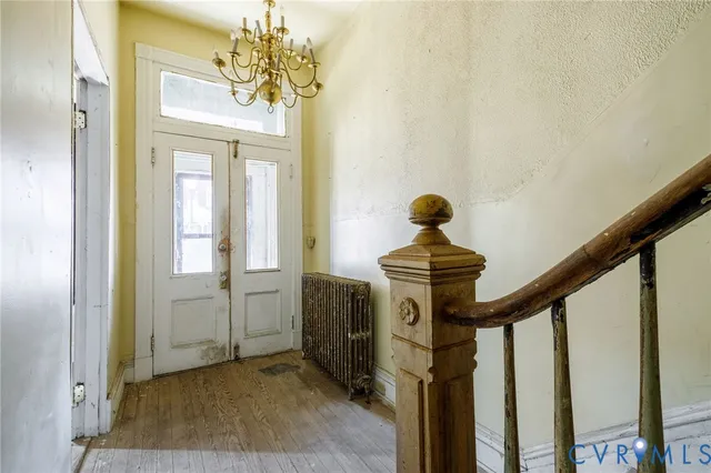 a view of an empty room with glass door