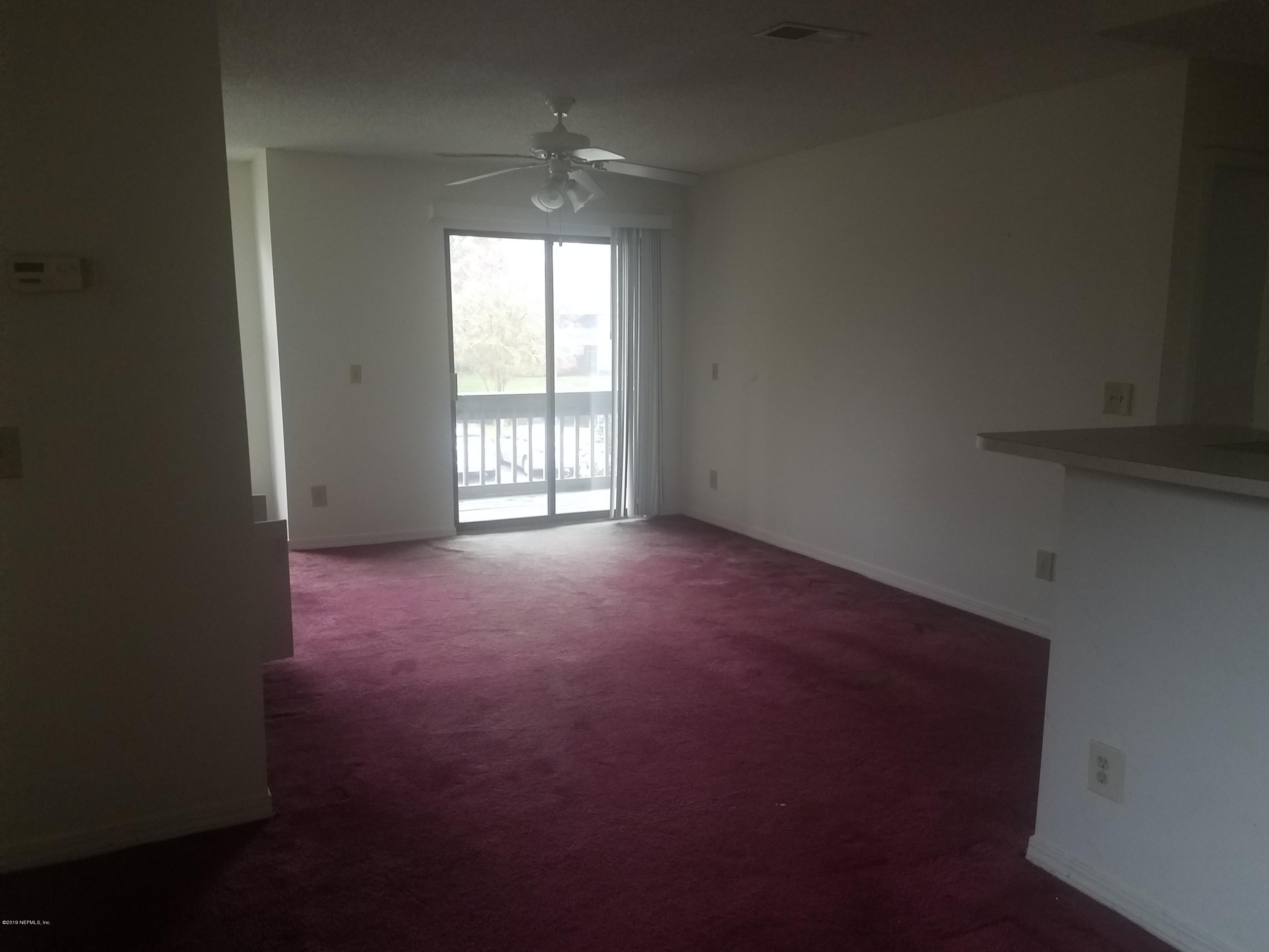 10200 Belle Rive Boulevard, Unit 256 Jacksonville, FL 32256 - Photo 3 of 18 an empty room with windows