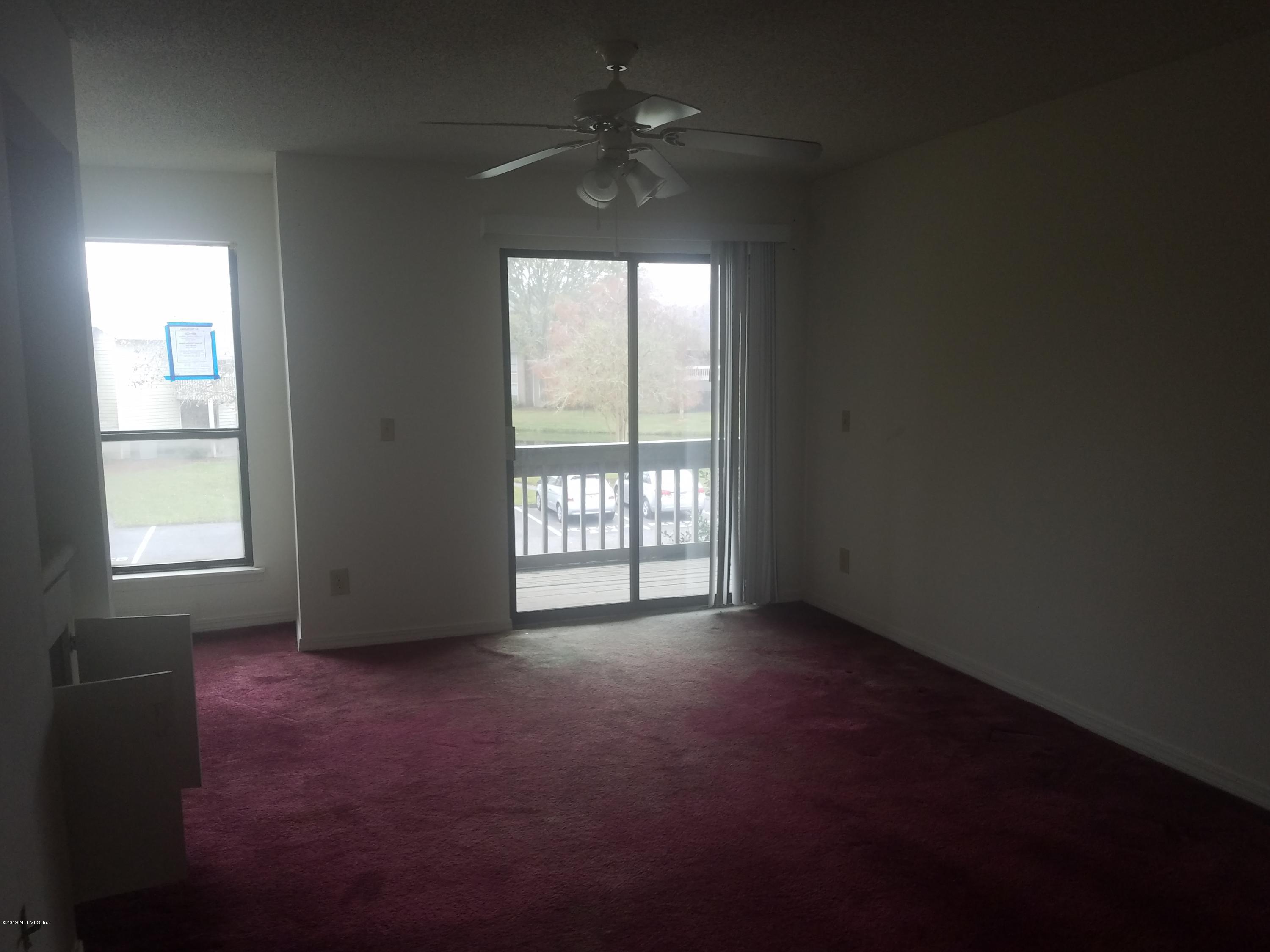 10200 Belle Rive Boulevard, Unit 256 Jacksonville, FL 32256 - Photo 4 of 18 a view of empty room with window