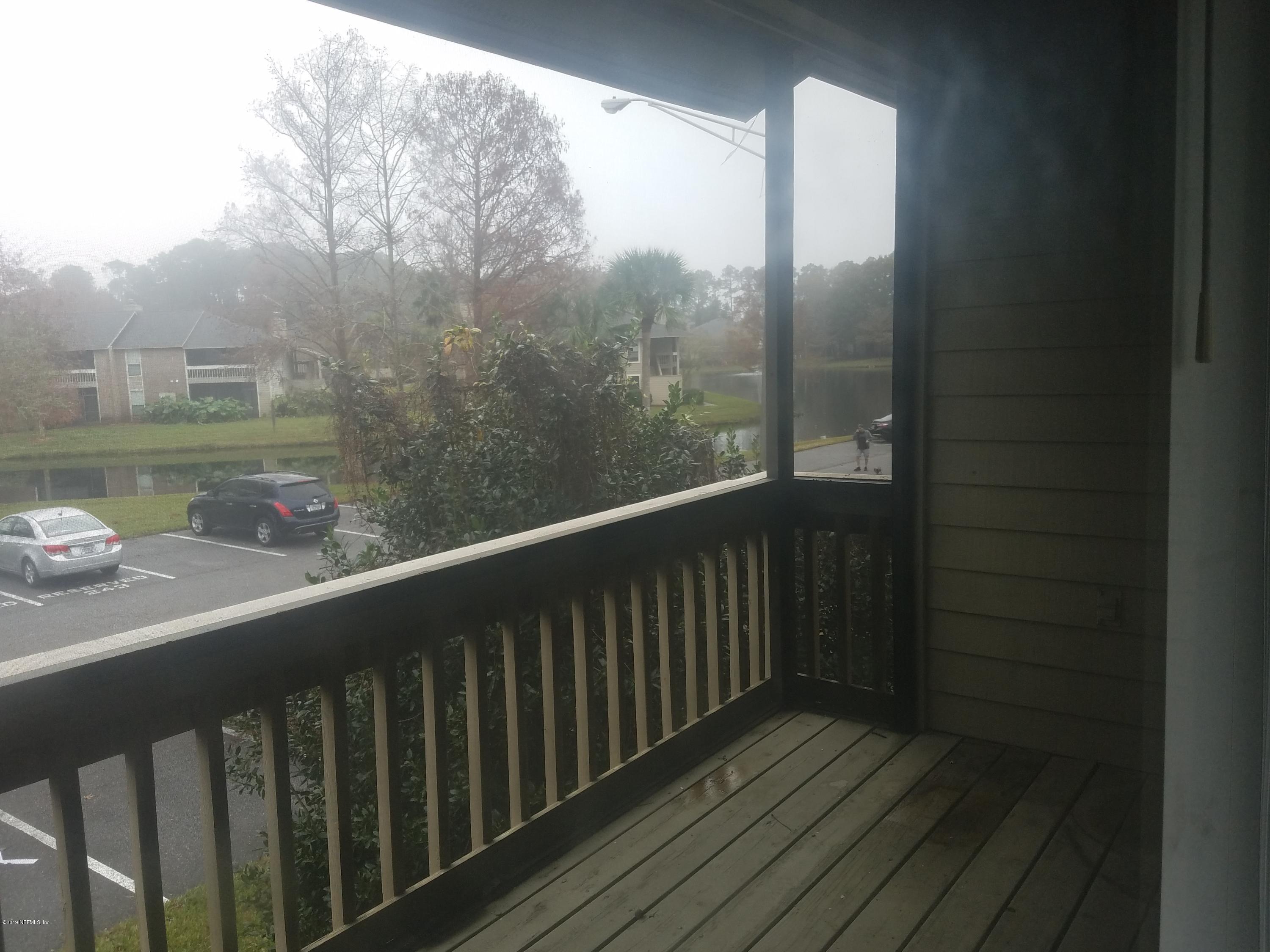 10200 Belle Rive Boulevard, Unit 256 Jacksonville, FL 32256 - Photo 7 of 18 a view of a balcony with wooden floor