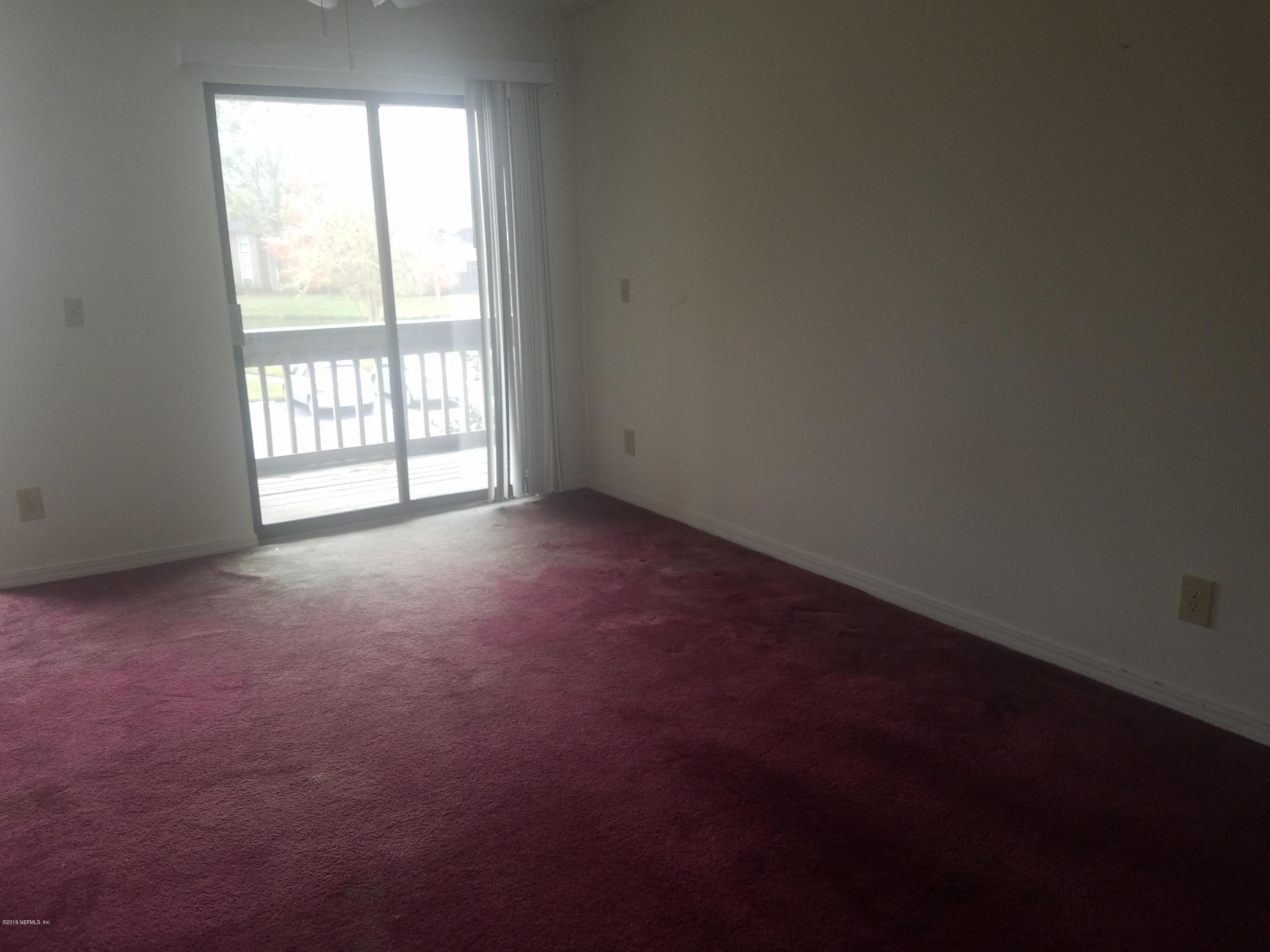 10200 Belle Rive Boulevard, Unit 256 Jacksonville, FL 32256 - Photo 10 of 18 an empty room with a window