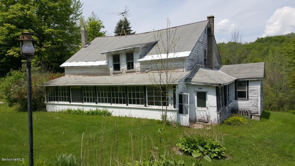 1269 Old Rte 9 Windsor, MA 01270 - Photo 24 of 32 a front view of a house with a garden and trees
