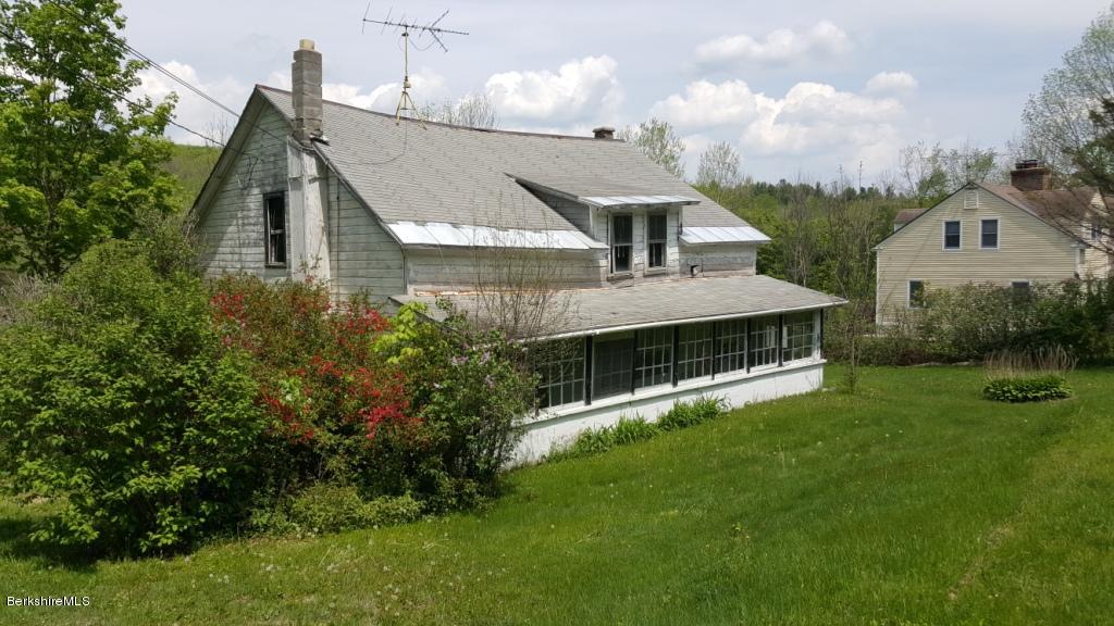 1269 Old Rte 9 Windsor, MA 01270 - Photo 31 of 32 a front view of a house with a garden and plants