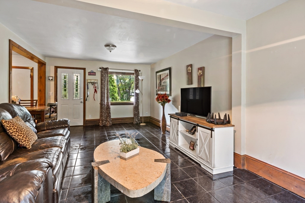 16 Martin Street Rehoboth, MA 02769 - Photo 11 of 38 a living room with furniture and a flat screen tv