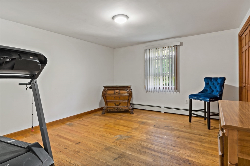 16 Martin Street Rehoboth, MA 02769 - Photo 20 of 38 a bedroom with a bed and wooden floor