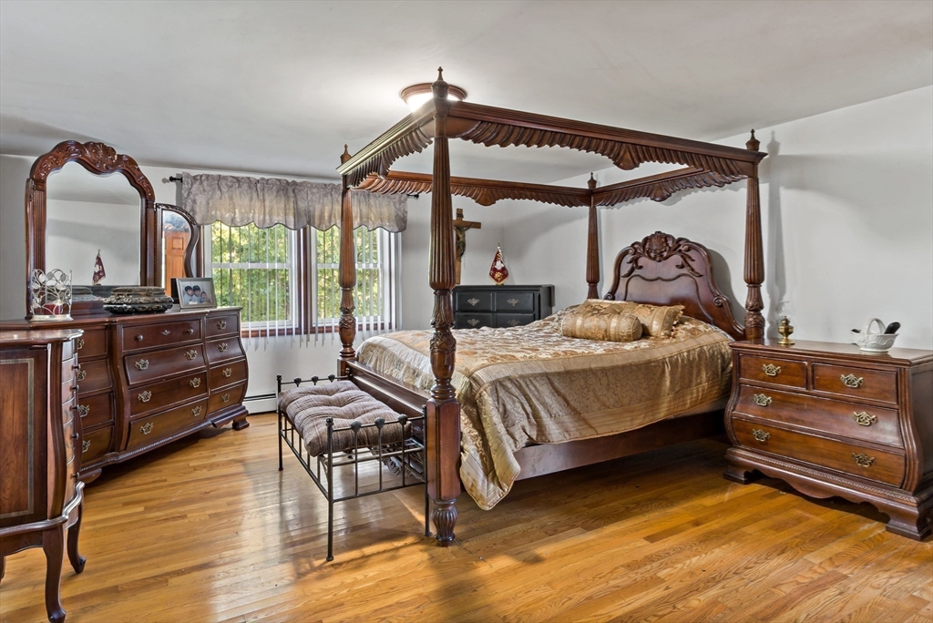 16 Martin Street Rehoboth, MA 02769 - Photo 27 of 38 a bedroom with furniture and wooden floor