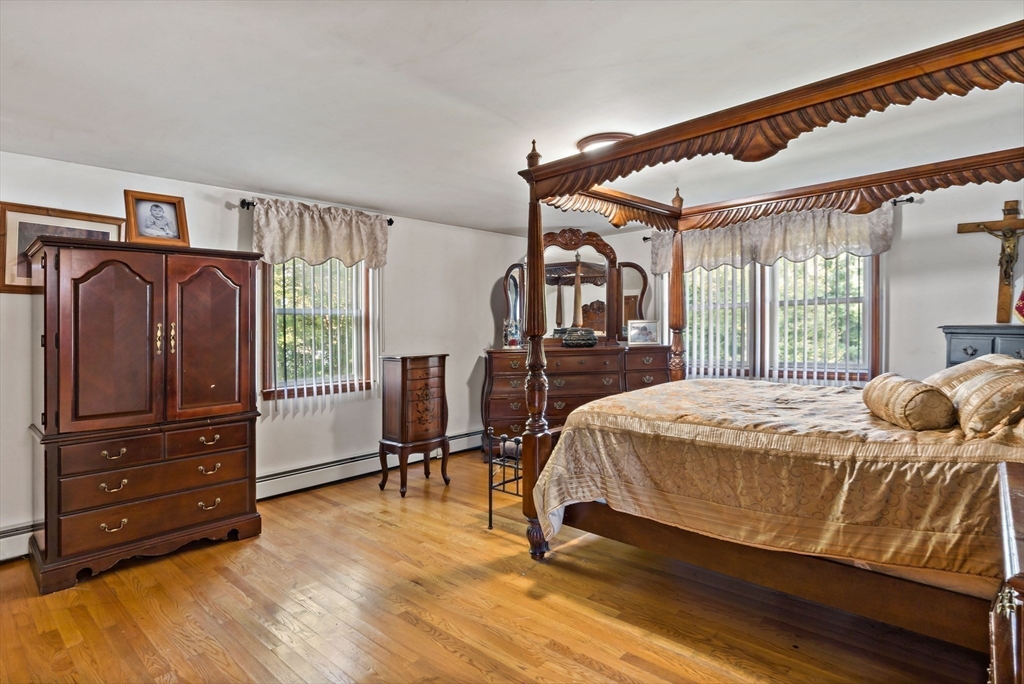 16 Martin Street Rehoboth, MA 02769 - Photo 28 of 38 a bedroom with a bed and wooden floor