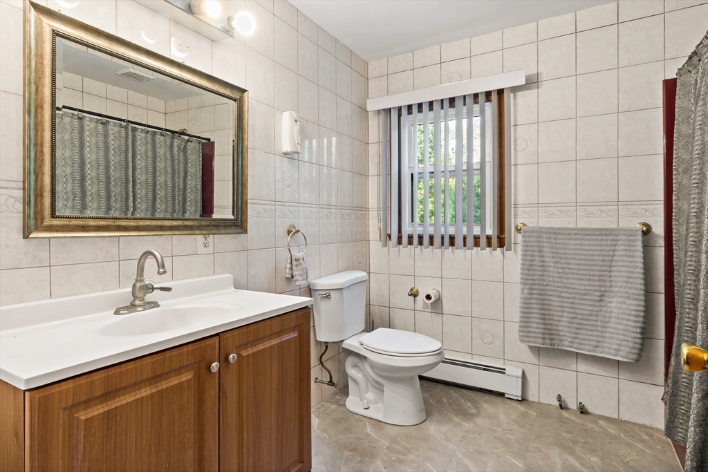 16 Martin Street Rehoboth, MA 02769 - Photo 30 of 38 a bathroom with a sink toilet and shower