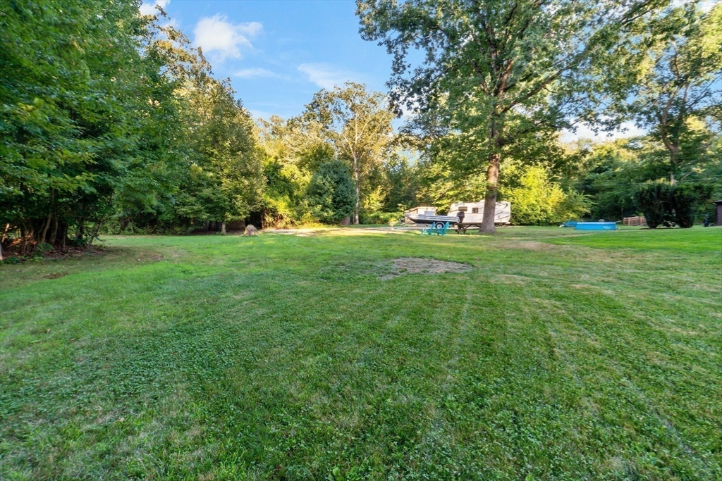 16 Martin Street Rehoboth, MA 02769 - Photo 34 of 38 a big yard with lots of green space and trees in the back
