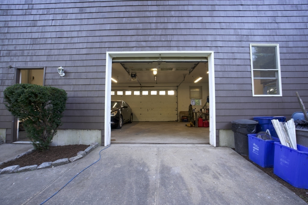 16 Martin Street Rehoboth, MA 02769 - Photo 35 of 38 a view of a brick house with potted plants and a building