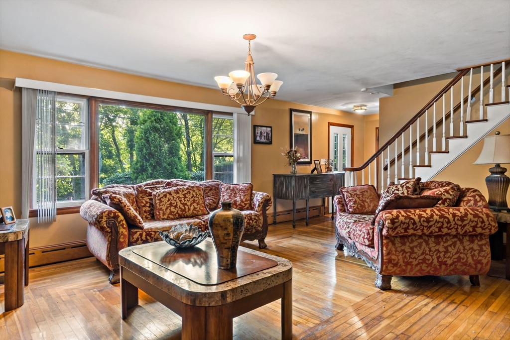 16 Martin Street Rehoboth, MA 02769 - Photo 6 of 38 a living room with furniture and a chandelier