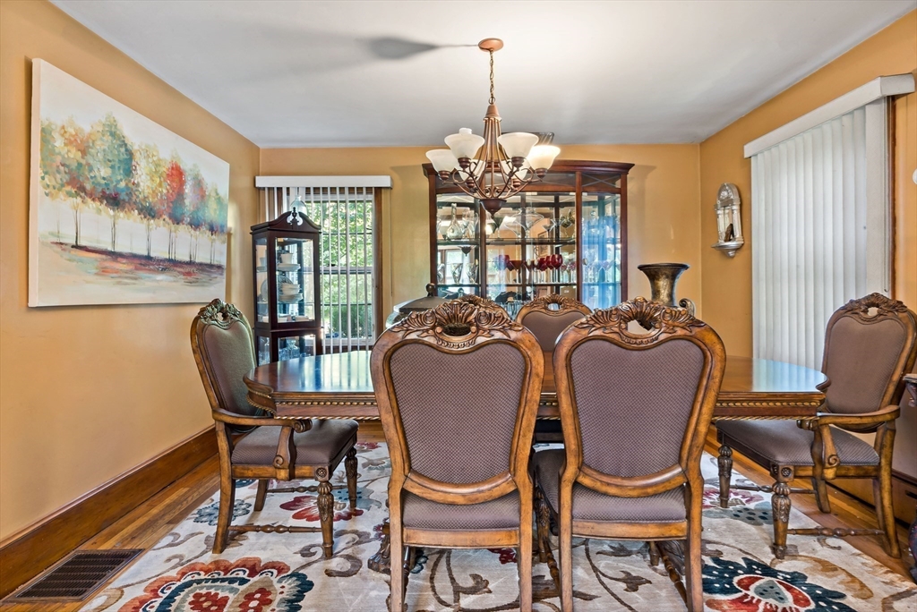 16 Martin Street Rehoboth, MA 02769 - Photo 9 of 38 a dining room with furniture a chandelier and wooden floor