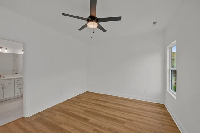 a bathroom with a double vanity sink and mirror