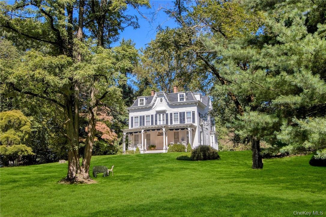 4 Deer Run Sparkill, NY 10976 - Photo 1 of 34 a front view of a house with a garden