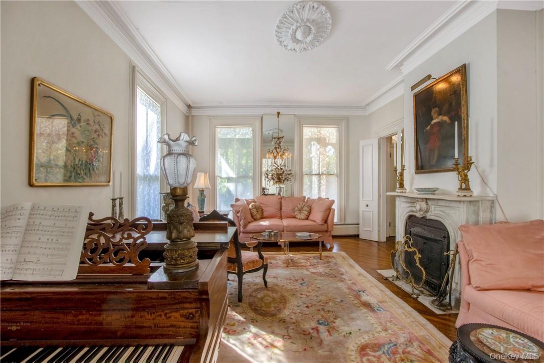 4 Deer Run Sparkill, NY 10976 - Photo 11 of 34 a living room with furniture large window and a fireplace