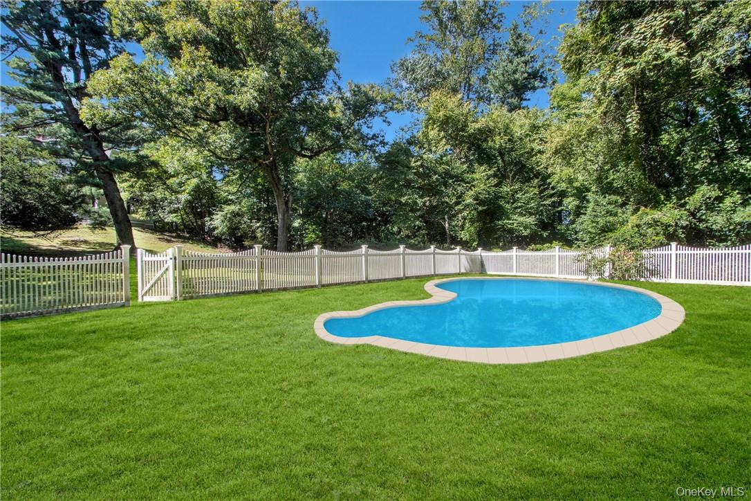 4 Deer Run Sparkill, NY 10976 - Photo 25 of 34 a view of a backyard with a swimming pool