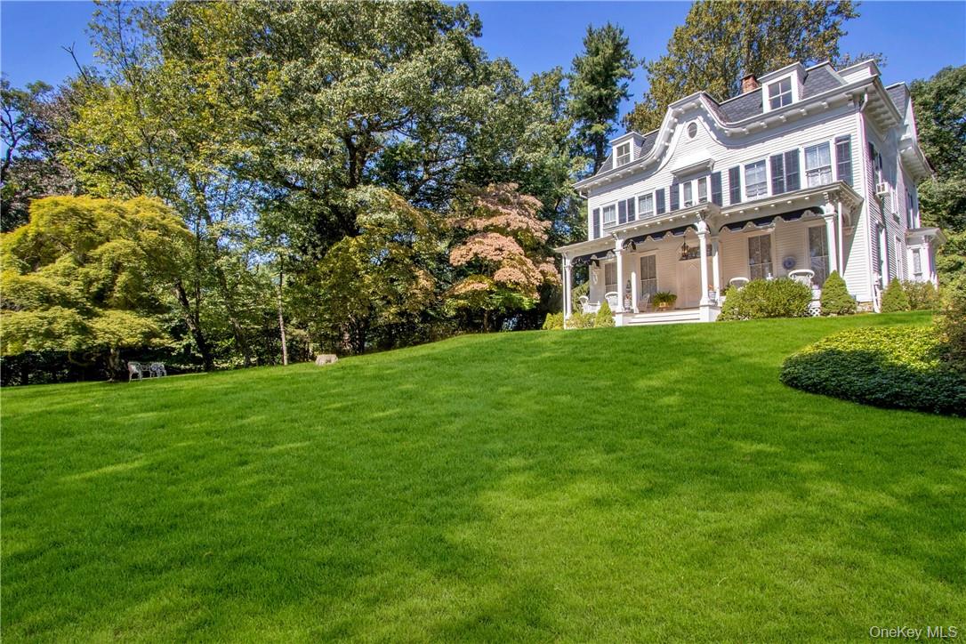4 Deer Run Sparkill, NY 10976 - Photo 29 of 34 a view of a white house with a big yard and large trees