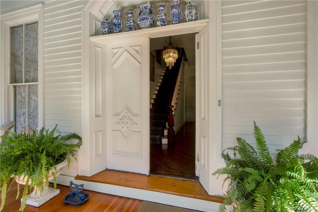 4 Deer Run Sparkill, NY 10976 - Photo 3 of 34 a potted plant sitting in front of a door