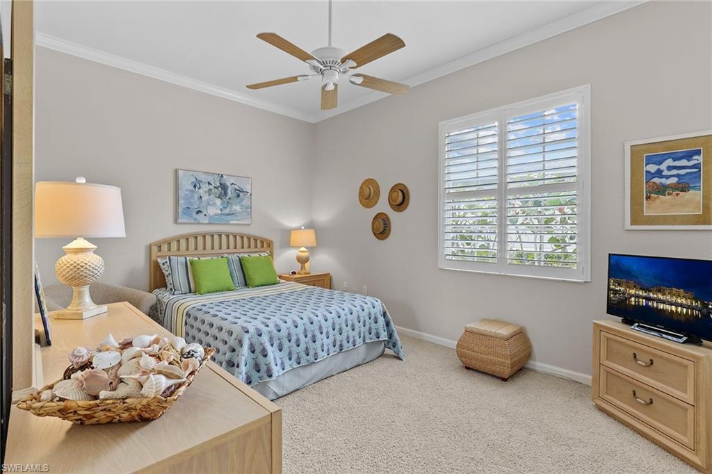 4541 Cardinal Cove Lane Naples, FL 34114 - Photo 15 of 42 a bedroom with a bed furniture and a window