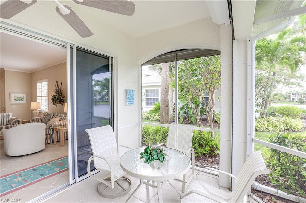 4541 Cardinal Cove Lane Naples, FL 34114 - Photo 18 of 42 a view of a dining room with furniture wooden floor and a potted plant