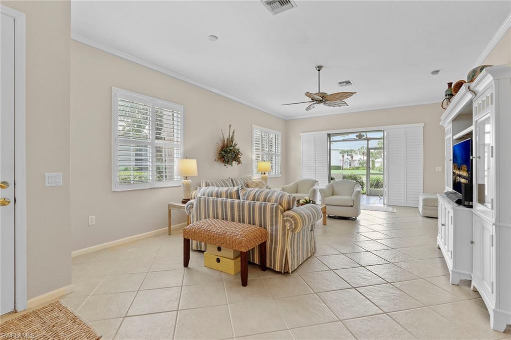 4541 Cardinal Cove Lane Naples, FL 34114 - Photo 2 of 42 a living room with furniture and a window