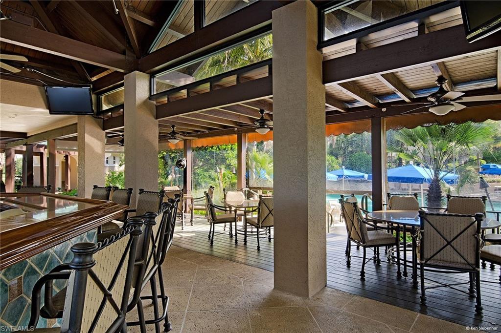 4541 Cardinal Cove Lane Naples, FL 34114 - Photo 31 of 42 a view of a dining room with furniture water and mountain view