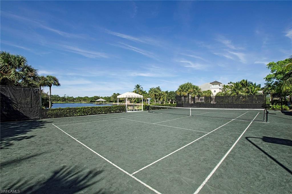 4541 Cardinal Cove Lane Naples, FL 34114 - Photo 38 of 42 a view of an outdoor space and tennis court