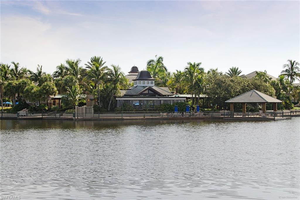4541 Cardinal Cove Lane Naples, FL 34114 - Photo 40 of 42 a view of a lake with a large trees