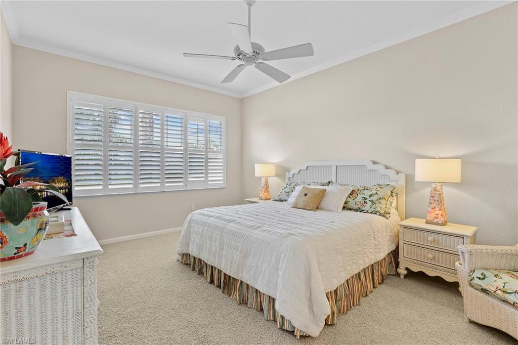4541 Cardinal Cove Lane Naples, FL 34114 - Photo 9 of 42 a bedroom with a bed and a window