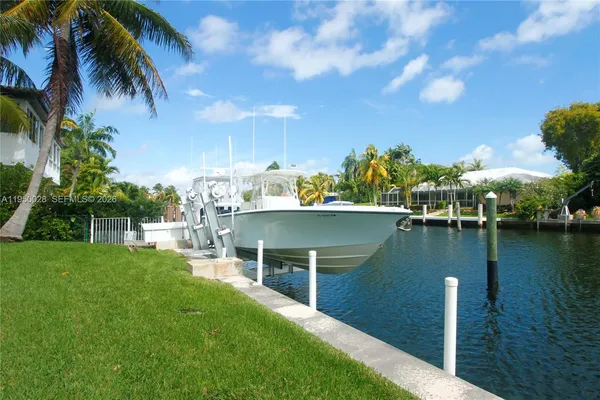 a view of a lake with a house in the background